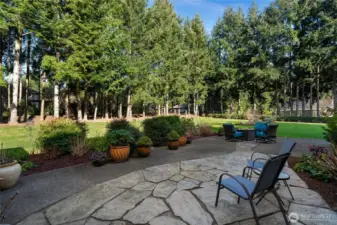 Bask in your outdoor ambiance with your own enclosed natural backyard. Covered for privacy and manicured for aesthetics.