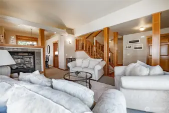 Formal living room, vaulted ceilings, double-sided gas fireplace