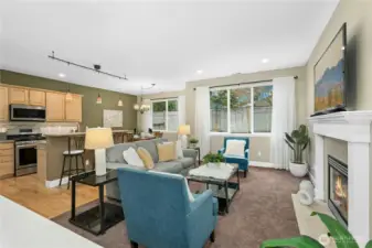 Great room features upgraded carpet & maple hardwoods