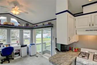 Spacious living room with slider door to large deck.