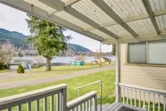 large, covered front deck with lake view for year around enjoyment