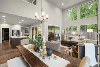 Dining Room & Living Room with Vaulted Ceiling and Large Picture Windows for Natural Light