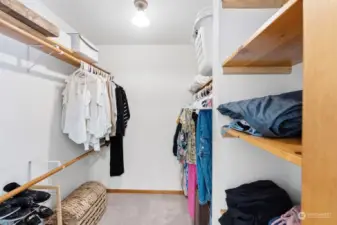 Good sized walk in closet with built in shelving.