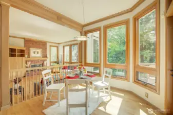 Sunny kitchen eating area overlooks back deck