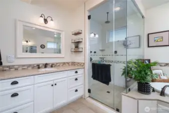 spacious primary bathroom with radiant heated flooring