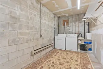 Laundry in garage serves flex room and upper level of main home