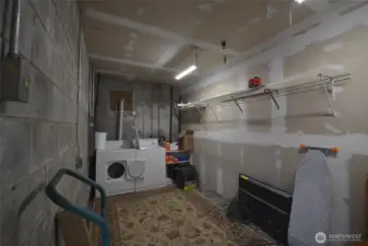 This is the laundry for the upper floor of the main home. Located in lower lower level of the garage.