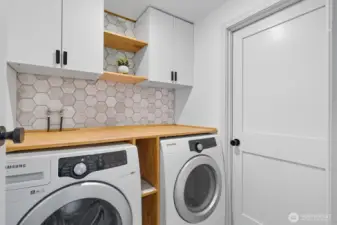 Utility room conveniently located.