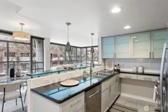 Granite countertops, breakfast bar & ample cabinetry.