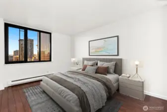 Primary bedroom w/ en-suite bath, Space Needle and water views! Furnishings virtually staged.