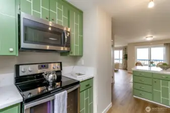 The opposite side of the kitchen with upgraded appliances.