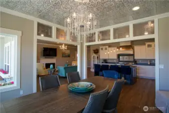 Formal Dining area with tin ceiling and fountain chandelier.