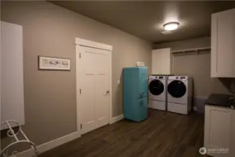 Main floor laundry-mud room off the garage and future pool bathroom area.