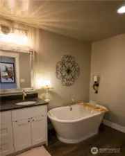 Upstairs guest bathroom soaking tub.