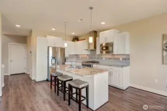 Sleek stainless steel appliances and center island.