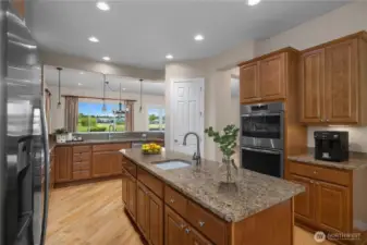 Stunning Kitchen with Granite Countertops, pullout shelves, Double oven, and stainless steel appliances.