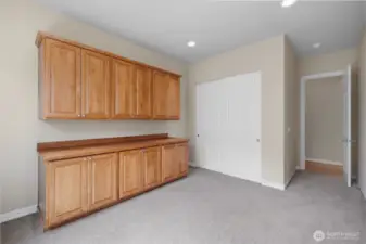 3rd Bedroom/Flex Space with large closet and custom built-in shelves.