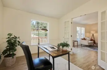 Glass double doors to this room bring in plenty of light. You will love the new (2025) durable luxury vinyl flooring that is throughout this home.