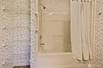 Full bath. Note the additional shelving for storage.