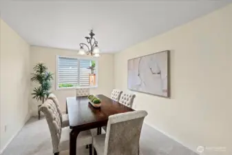 The formal dining room is conveniently located between the living room and kitchen