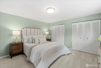 Primary bedroom with dual closets and ample storage