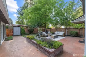 Beautiful stamped concerete patio with level entry to the house and cottage. Enjoy the tranquil fountain and raised planting beds. Low maintenance yard in front and back. Sprinkler system in front and side yard.