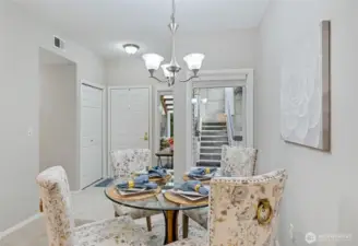 Another look at the Dining Room toward the entry. The hallway to the left leads to the Kitchen, laundry, full bathroom, and second bedroom. Let's go explore the Living Room first.