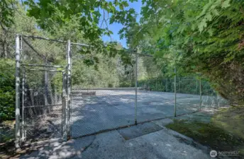 Private community Tennis court located at the front end of the property.