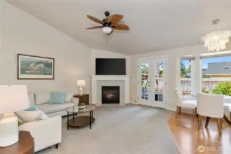 The soaring ceilings keep the room feeling casual and comfortable. (The lighting fixture over the breakfast table does not convey)