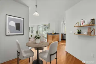 Dining area – Positioned near the entry with floor-to-ceiling mirrors that enhance brightness and space
