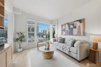 Beautifully renovated throughout with wood floors, circular floor plan and grand windows drenched in natural light.