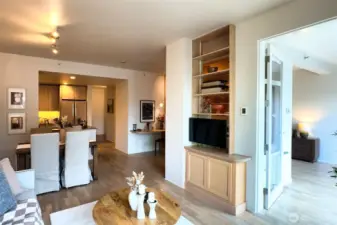 Here you can see the custom built-ins and the glass door which leads to the primary bedroom.