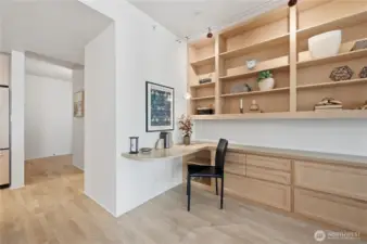 Another look at the den area off the main living area with a window looking out to the deck for natural light.