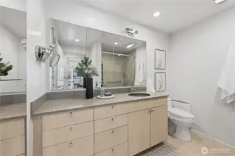 Gorgeous, renovated bath with glass walk-in shower, custom blown-glass sink and granite counter with beautiful tile floors.
