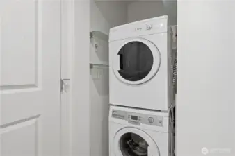 Stack laundry in the bathroom tucked neatly behind the door.