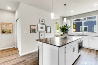 Gallery wall space behind the lexpansive island