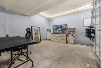 Tandem garage with bonus workspace area, excellent space for hobbies, storage, projects, or a home gym setup.