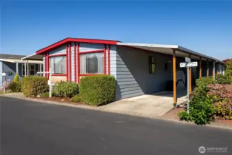 #237 with large carport and big shed with electricity and lights. Perfect for project, gardening tools and extra storage!