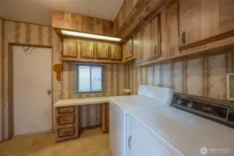 Laundry room with lots of cupboards and a large pantry not in photo. Washer/Dryer included.