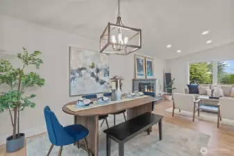 Dining space with modern statement lighting and direct access to the backyard deck for easy indoor-outdoor living.