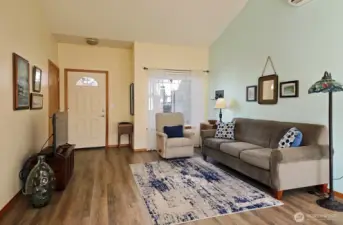 Living room, with coat closet next to front door.