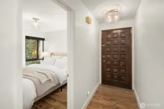 First room on the right upon entering- Note the high end light fixtures and the very cool front door detailing!