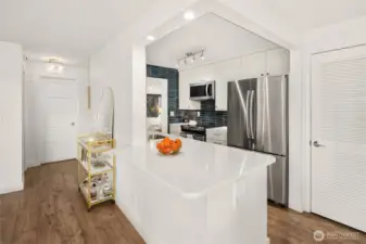 Closer view of the open breakfast bar and SS appliances!