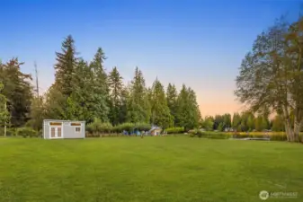 Huge open yard leads to private dock to enjoy boating, swimming, fishing & more!