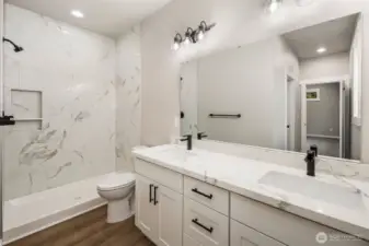 Dual Vanity, quartz counters, LVP flooring, spa-inspired attached bath!