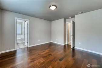 Primary Bedroom with Hardwood Floors.