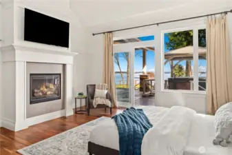 The primary ensuite has a propane fireplace, private access to the covered deck and hot tub, walk-in closet and beautiful 4-piece bath with heated marble floors.