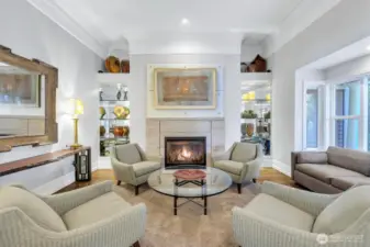 Gas fireplace flanked by custom built ins