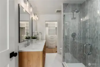 Dreamy designer bathroom with Bedrosian tiles and gorgeous cabinetry. Walk-in closet with closet system to keep everything organize and in one place.