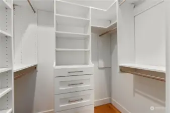 Primary closet with built-ins for easy access and organzation.